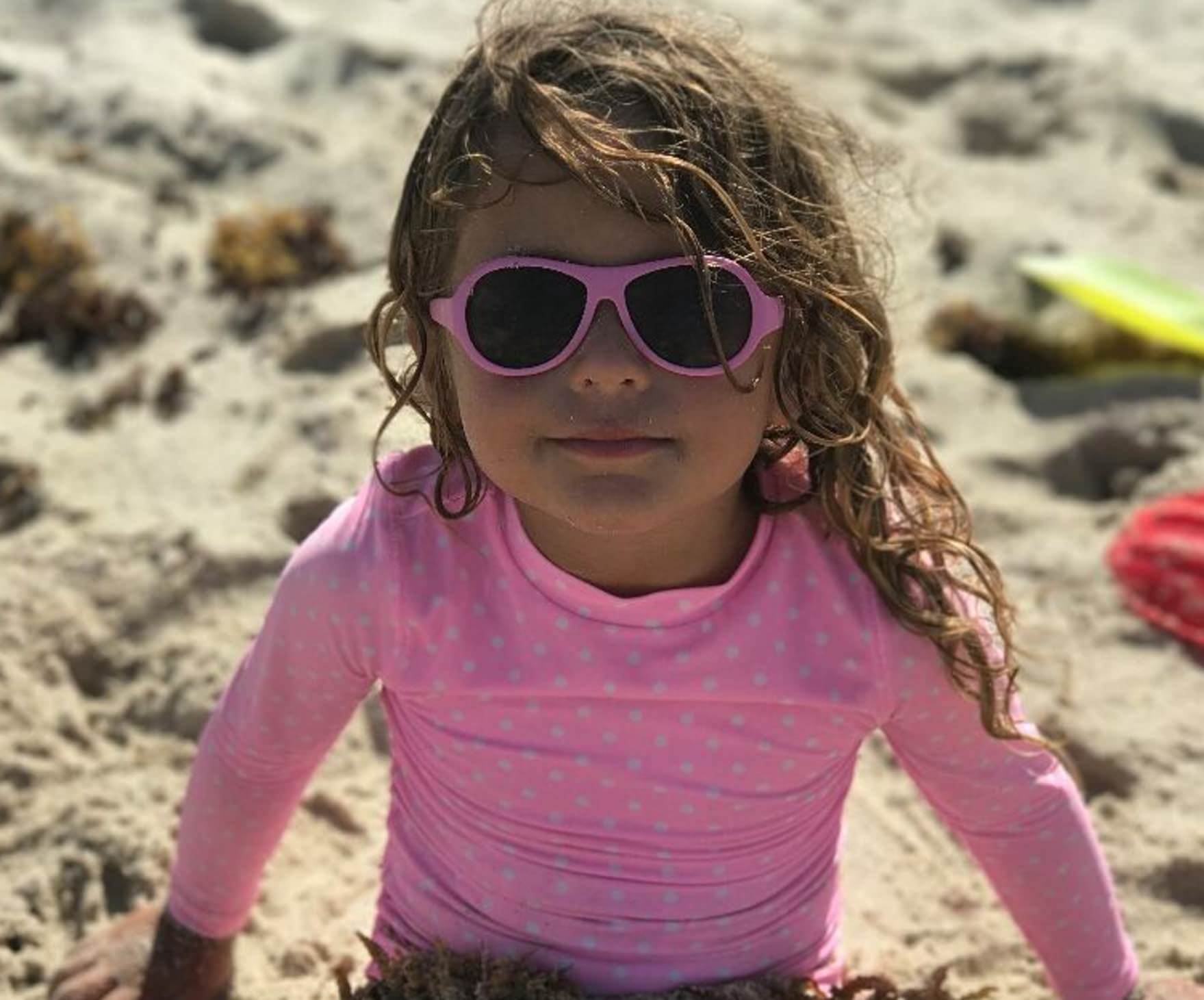 Girl with pink aviator sunglasses